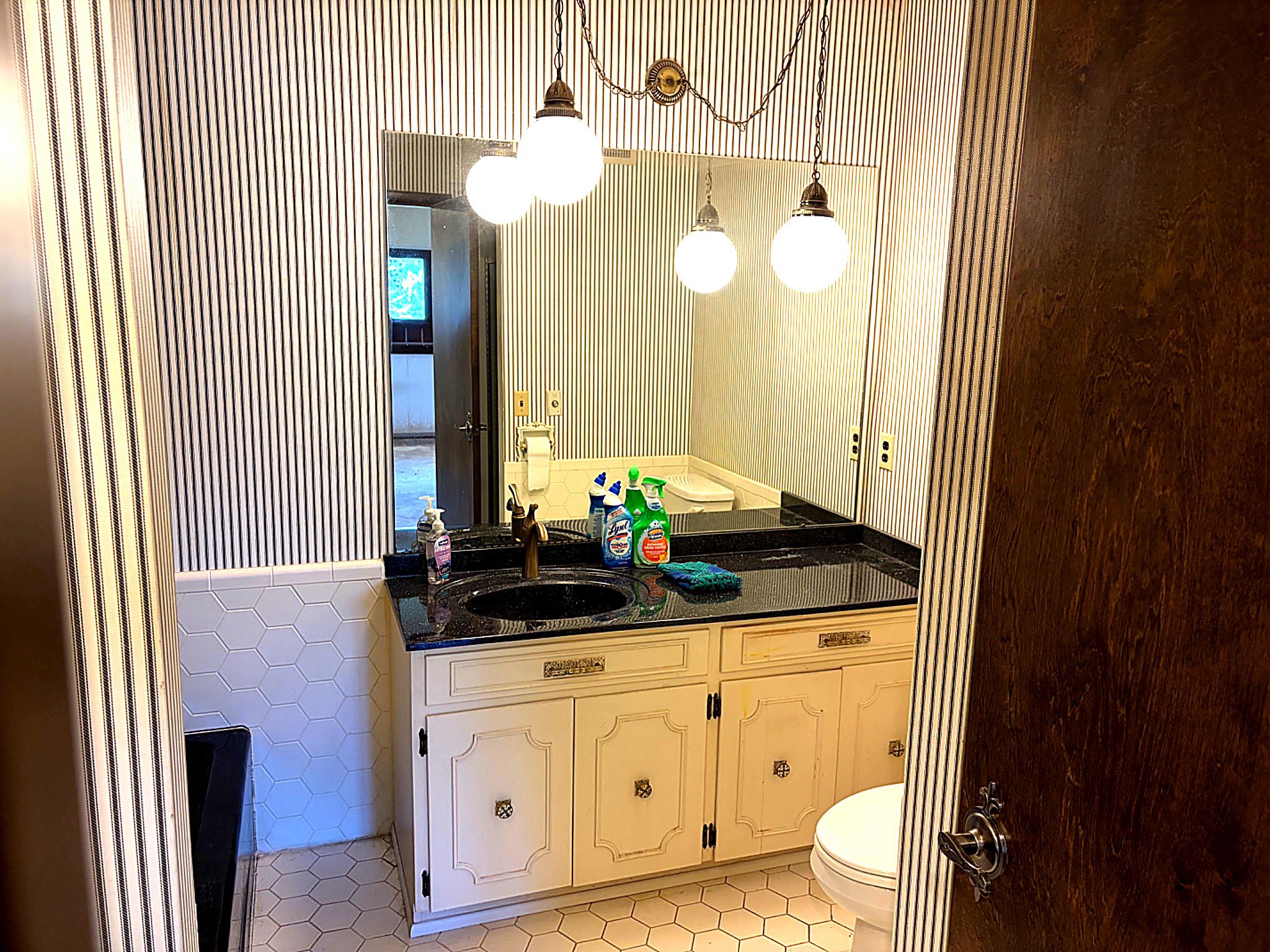 1590 East Elmer Road Vineland, NJ 08361 - Photo 16 of 25 a bathroom with a granite countertop sink and a mirror