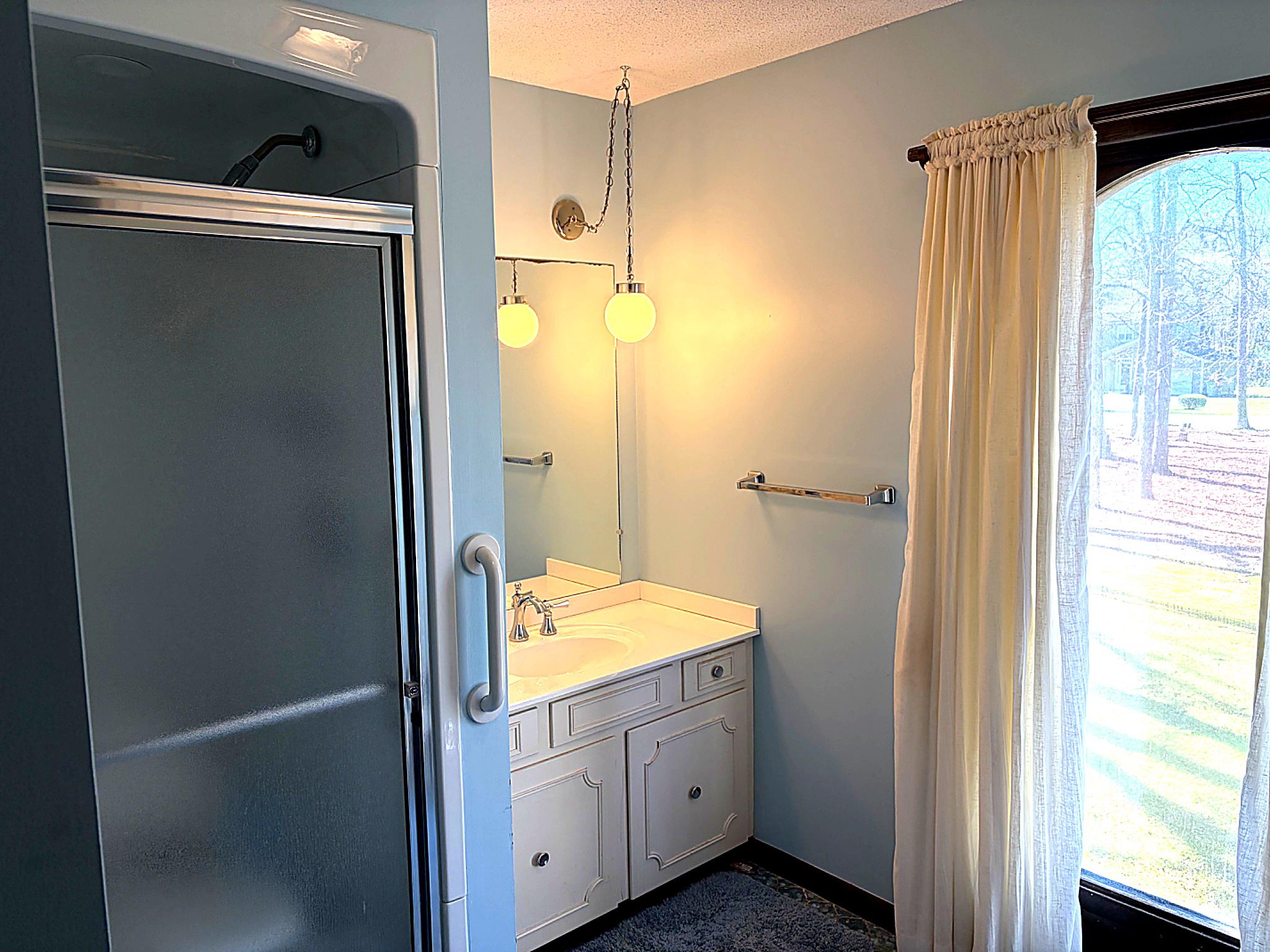 1590 East Elmer Road Vineland, NJ 08361 - Photo 19 of 25 a bathroom with a shower and a sink