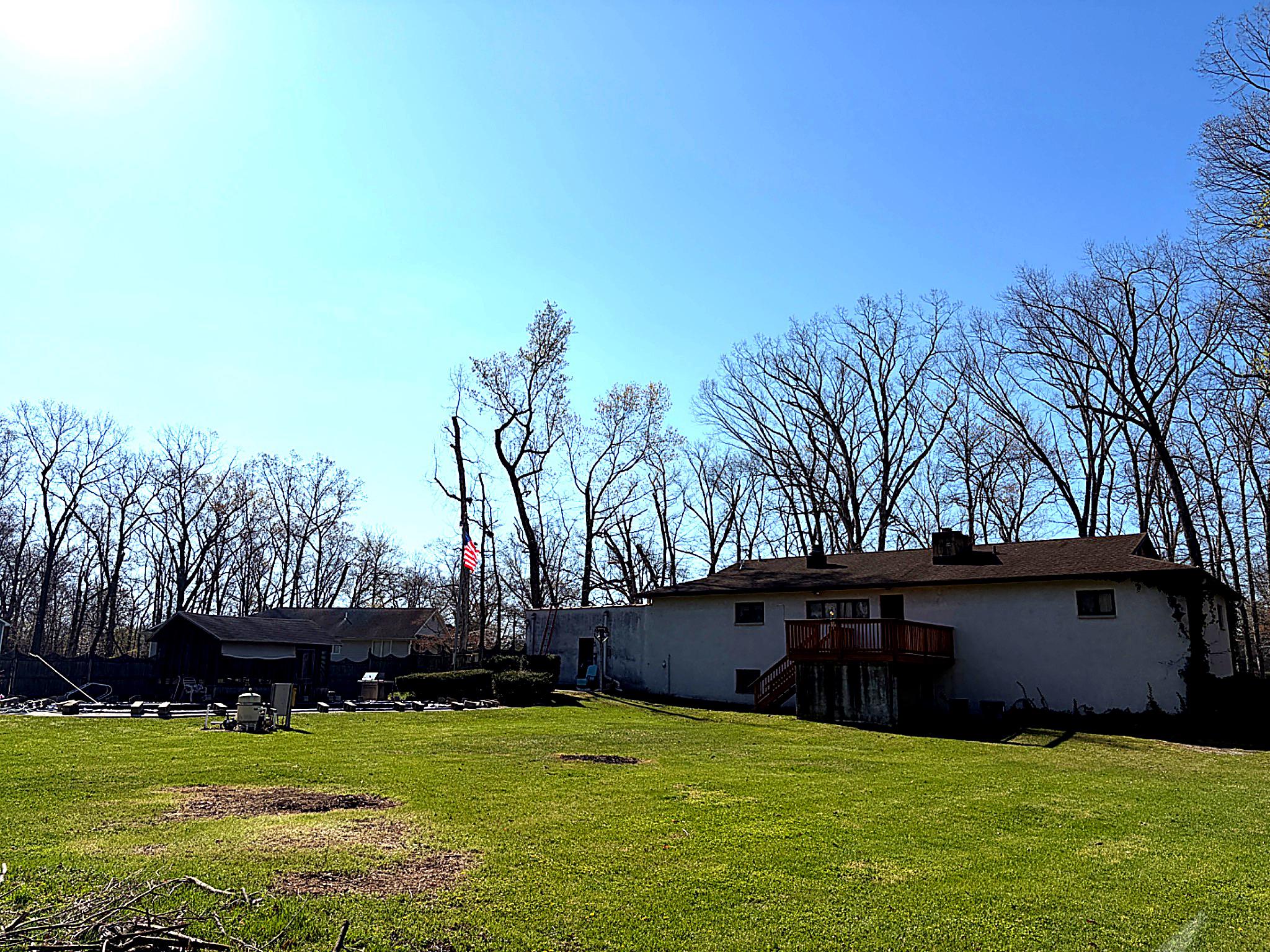1590 East Elmer Road Vineland, NJ 08361 - Photo 3 of 25 a view of a tree in front of a house