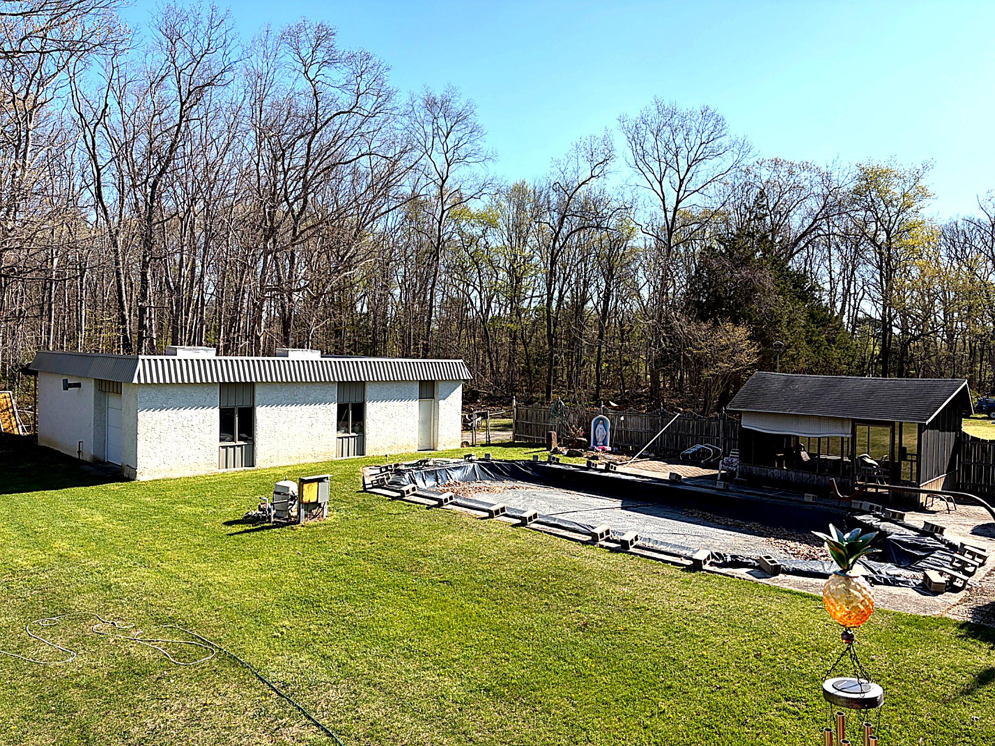 1590 East Elmer Road Vineland, NJ 08361 - Photo 4 of 25 a view of a house with pool and chairs
