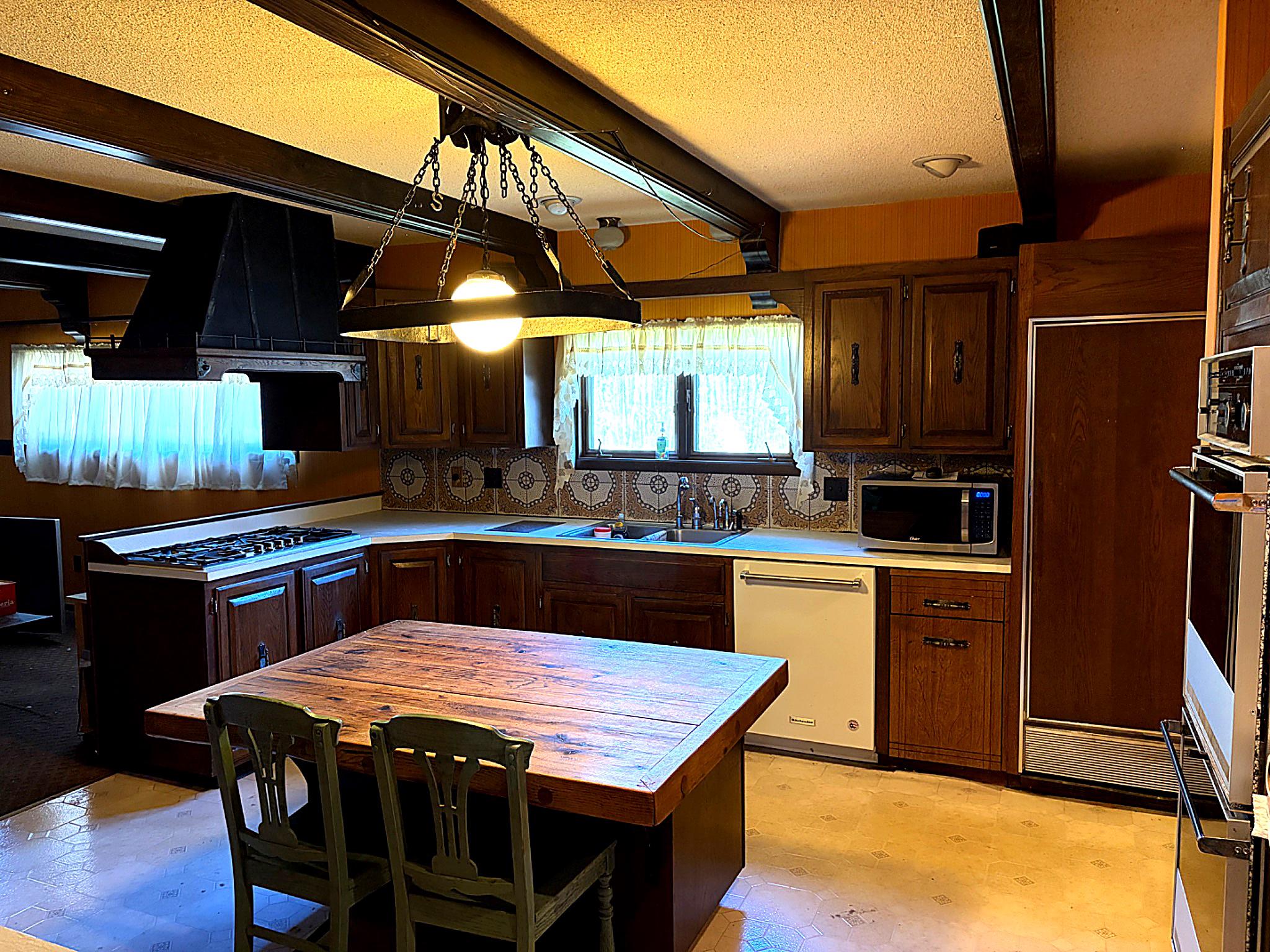1590 East Elmer Road Vineland, NJ 08361 - Photo 8 of 25 a kitchen with stainless steel appliances granite countertop a stove a sink dishwasher and a microwave oven with cabinets