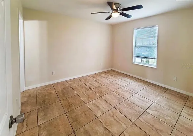 a view of an empty room and window