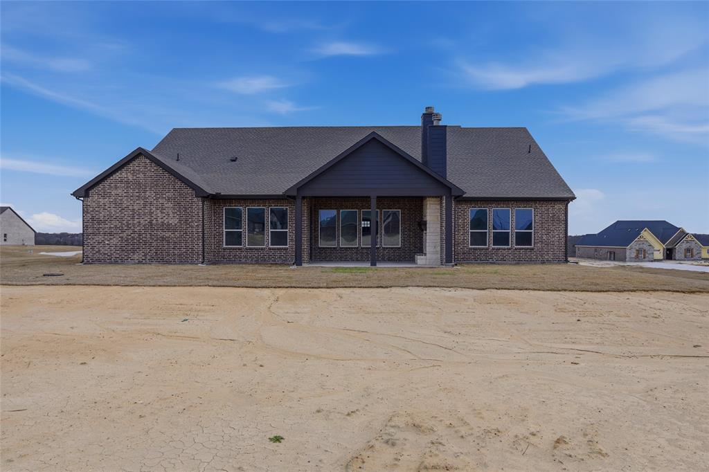 812 Vly Rdg Road Van Alstyne, TX 75495 - Photo 32 of 33 front view of a house with a yard