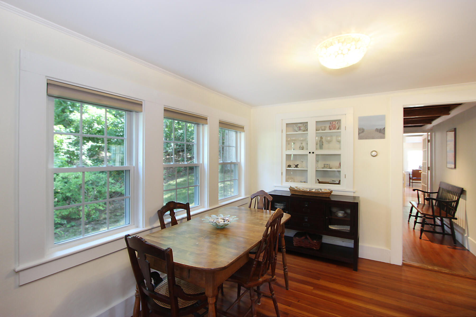 29 Pond Road Orleans, MA 02653 - Photo 13 of 41 a view of a dining room with furniture window and wooden floor
