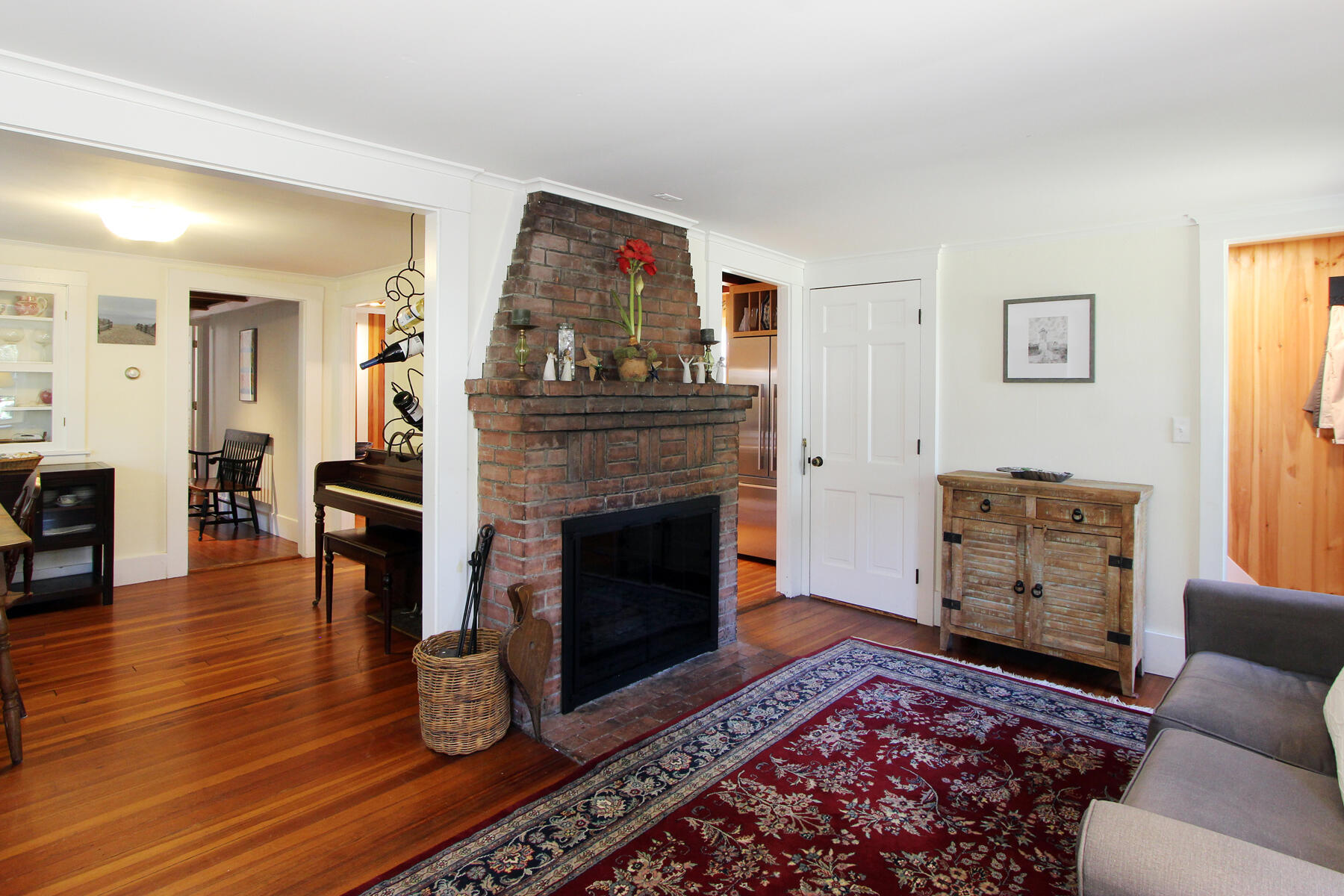 29 Pond Road Orleans, MA 02653 - Photo 14 of 41 a living room with furniture and a fireplace