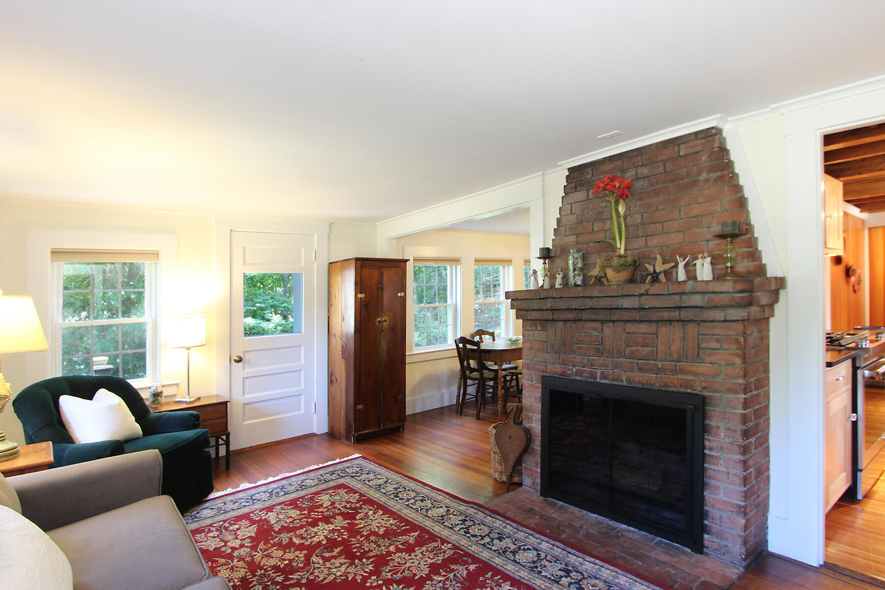 29 Pond Road Orleans, MA 02653 - Photo 15 of 41 a living room with furniture and a fireplace