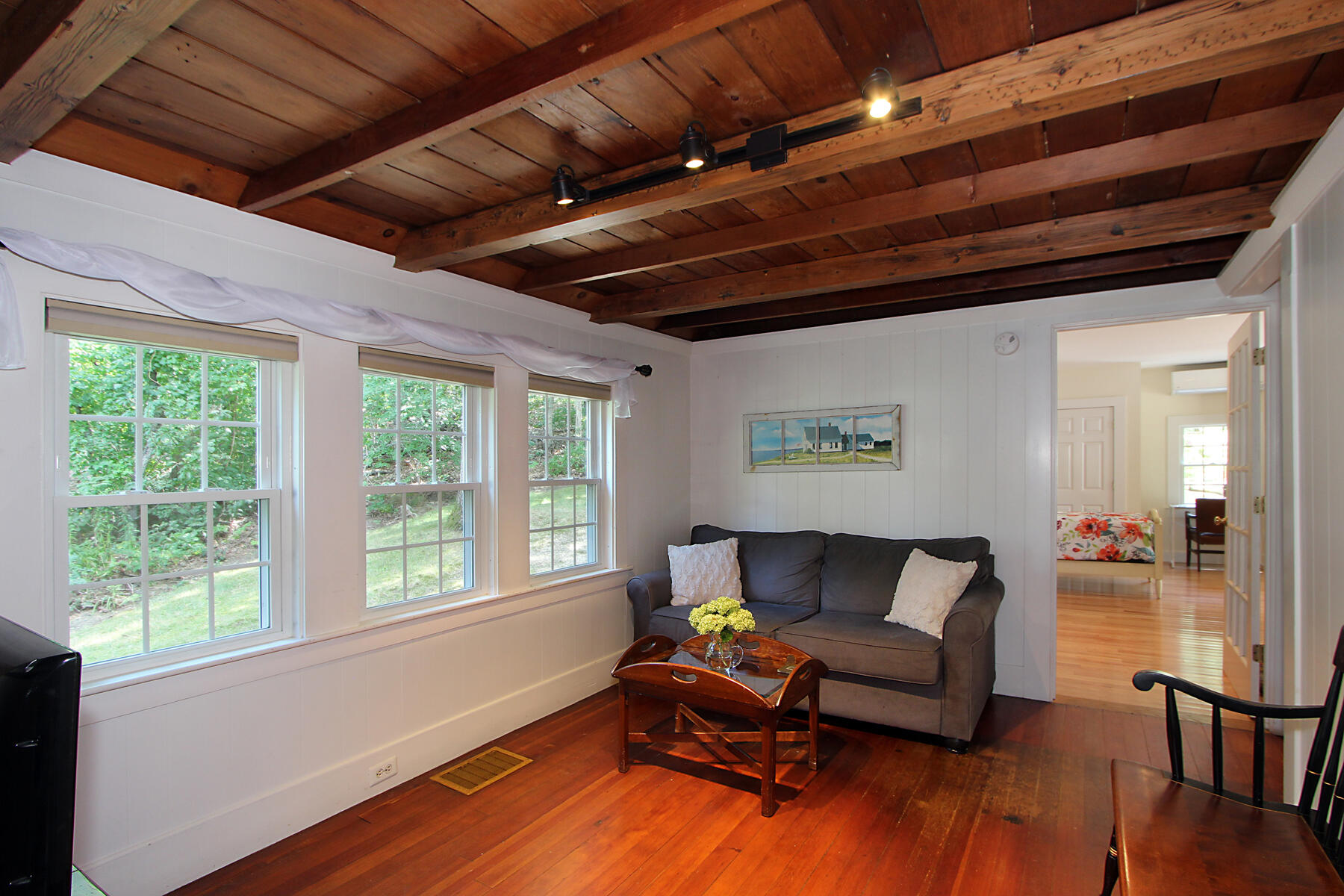 29 Pond Road Orleans, MA 02653 - Photo 16 of 41 a living room with furniture and a window