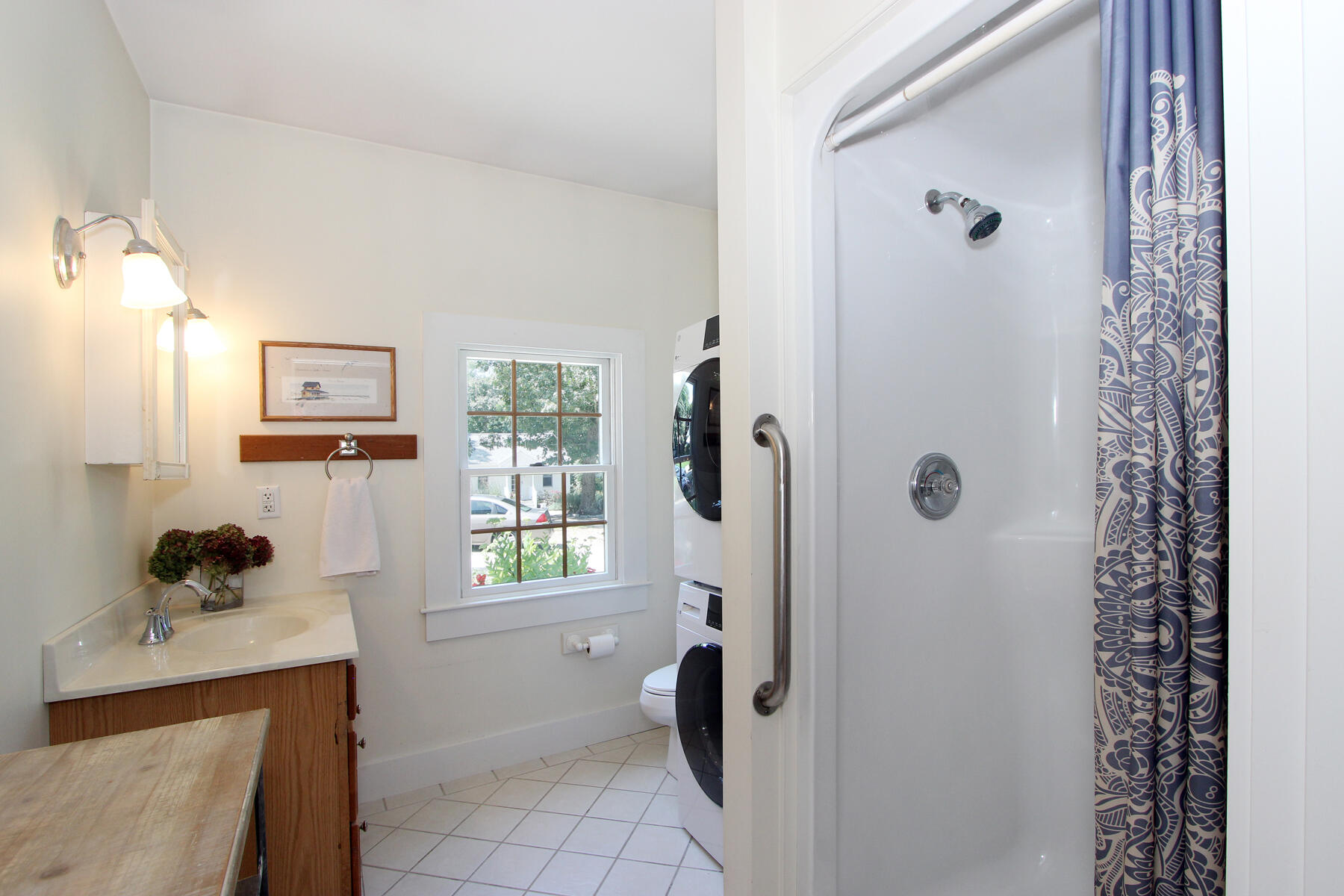 29 Pond Road Orleans, MA 02653 - Photo 20 of 41 a bathroom with a granite countertop shower a window and a shower