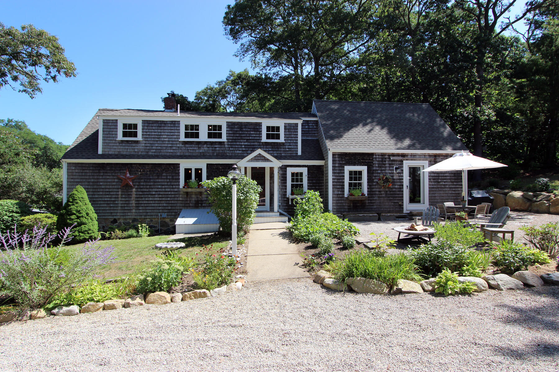 29 Pond Road Orleans, MA 02653 - Photo 2 of 41 front view of a house with a yard