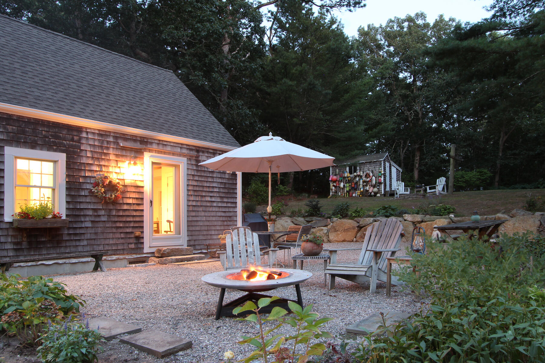29 Pond Road Orleans, MA 02653 - Photo 27 of 41 a backyard of a house with outdoor seating