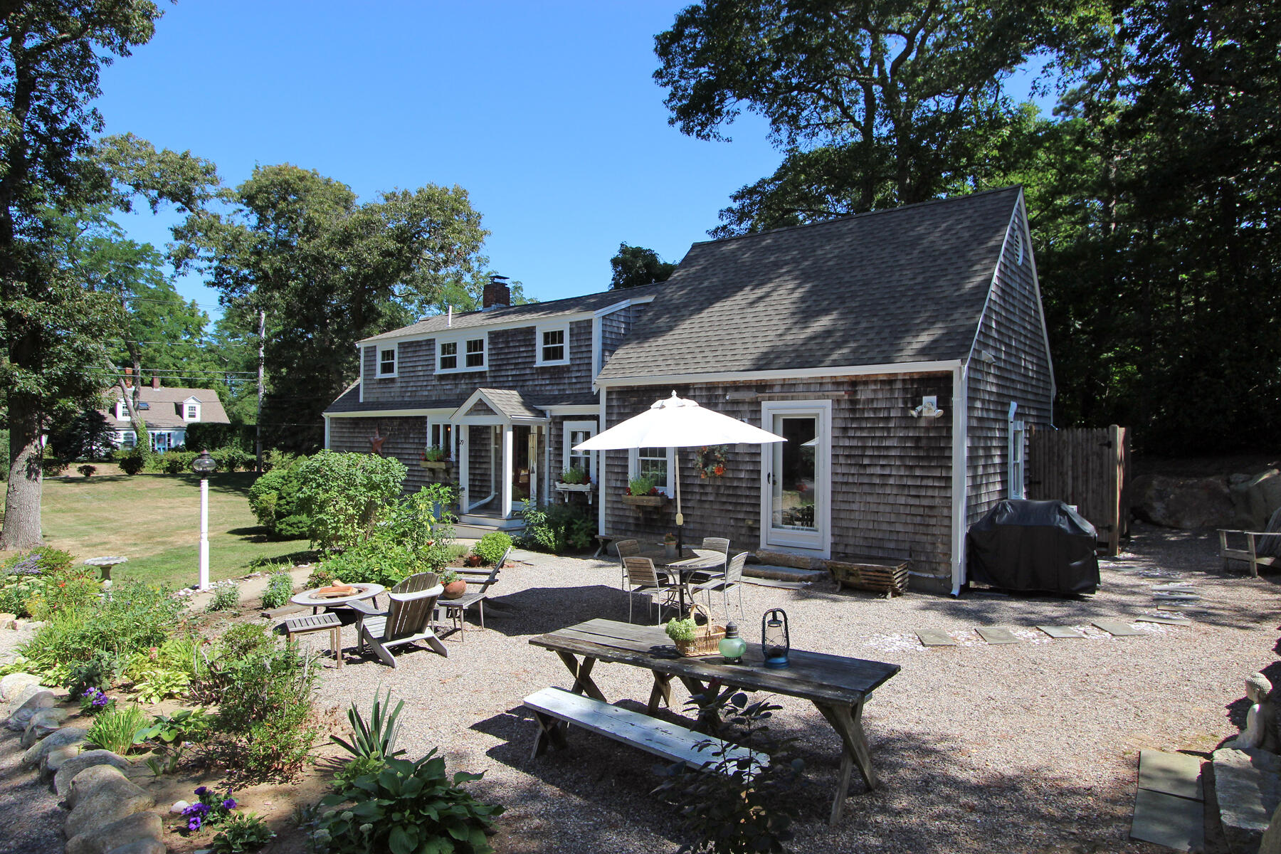 29 Pond Road Orleans, MA 02653 - Photo 3 of 41 a front view of a house with patio