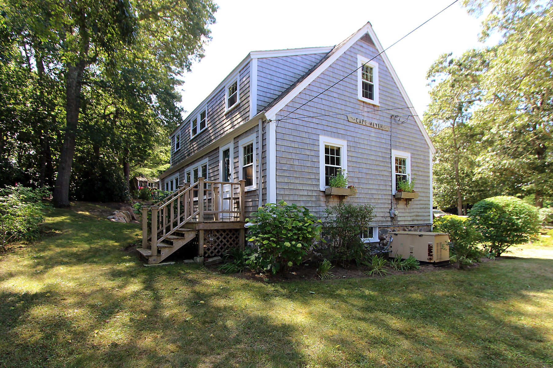 29 Pond Road Orleans, MA 02653 - Photo 31 of 41 a view of a house with a yard