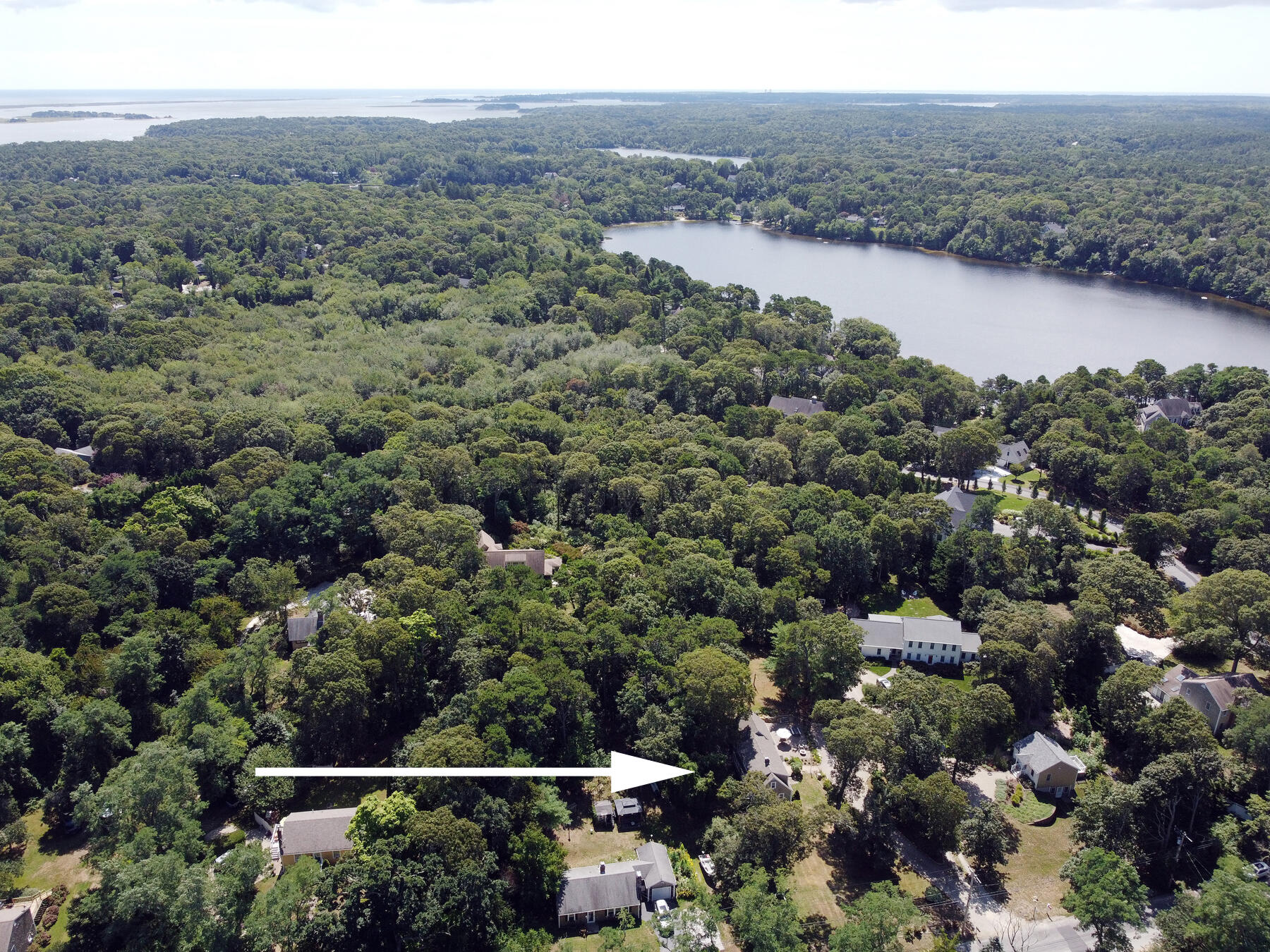 29 Pond Road Orleans, MA 02653 - Photo 37 of 41 an aerial view of a town with trees