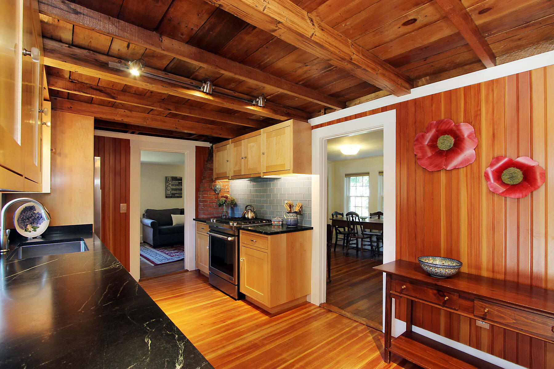 29 Pond Road Orleans, MA 02653 - Photo 7 of 41 a kitchen with stainless steel appliances granite countertop a stove and a refrigerator