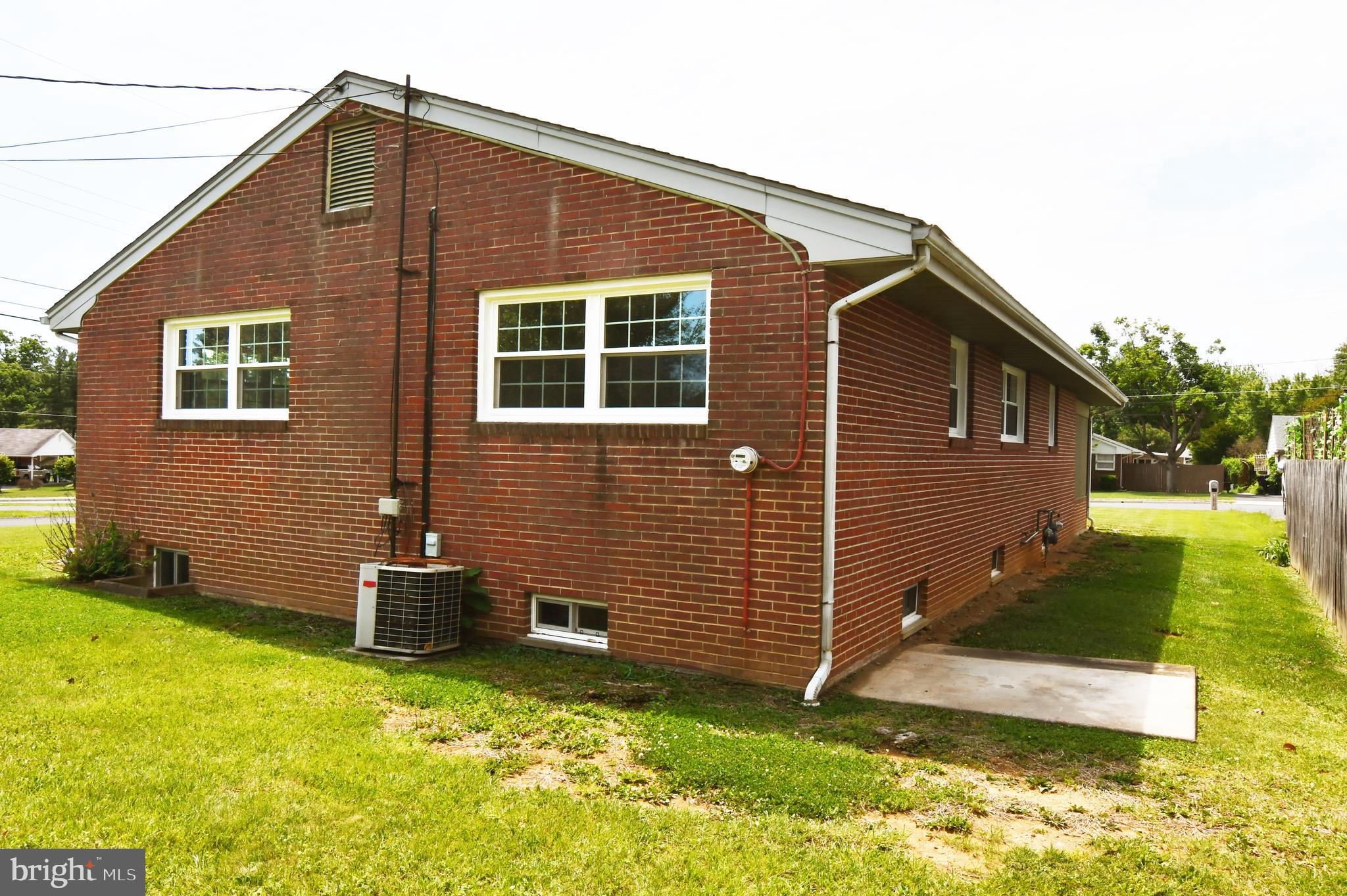 437 Beechcroft Road Winchester, VA 22601 - Photo 49 of 52 a front view of a house with a yard