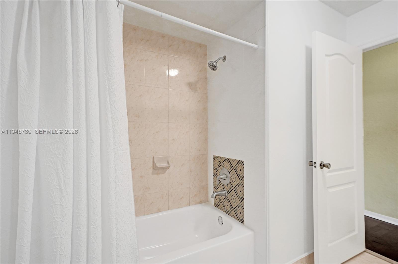 5502 Southwest 162nd Place Miami, FL 33185 - Photo 44 of 72 a bathroom with a shower and a bath tub