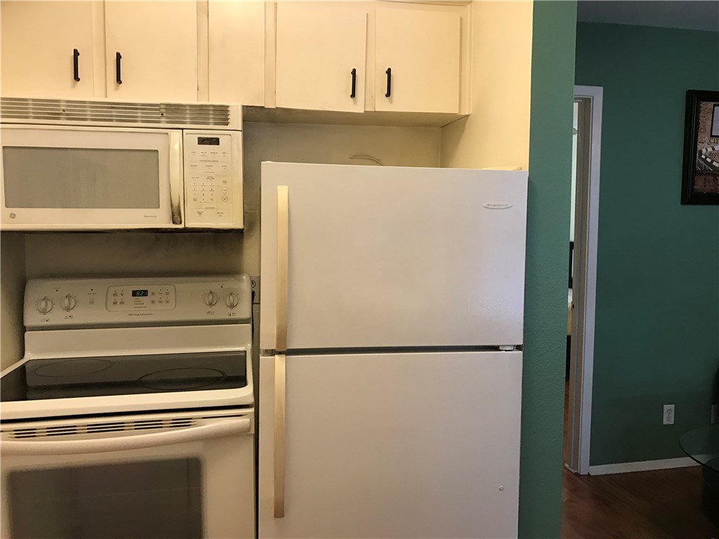 3400 Speedway, Unit 304 Austin, TX 78705 - Photo 6 of 12 a close view of a stove and a refrigerator