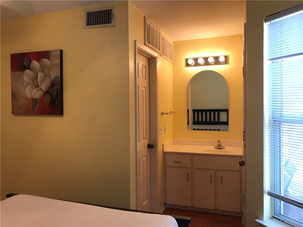 3400 Speedway, Unit 304 Austin, TX 78705 - Photo 10 of 12 a bathroom with a sink and a mirror