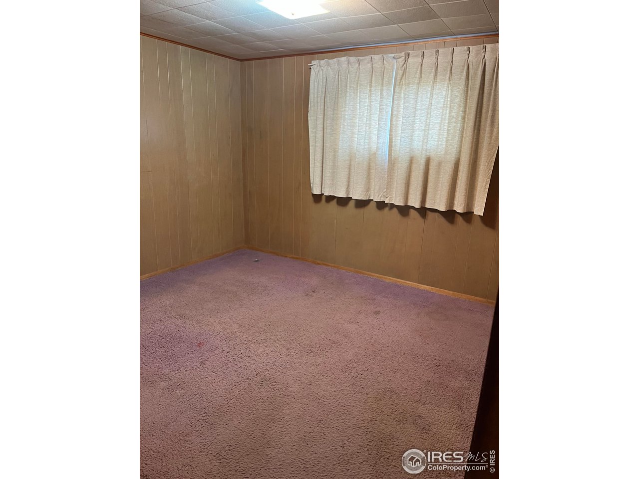 134 Main Street Wray, CO 80758 - Photo 2 of 6 a view of an empty room with a window