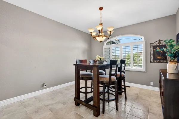 a view of a dining room and a chandelier