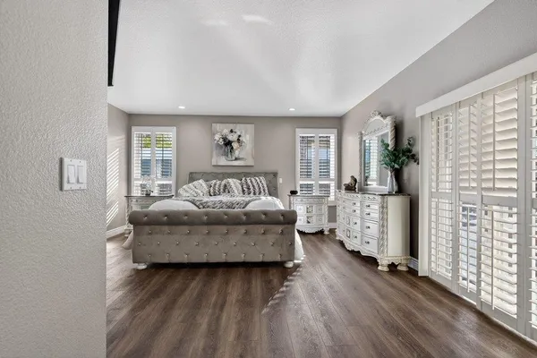 a bedroom with bed and window