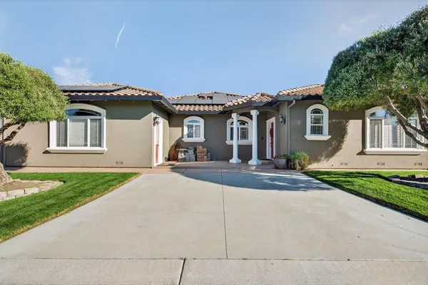 a view of a dining room with furniture and window