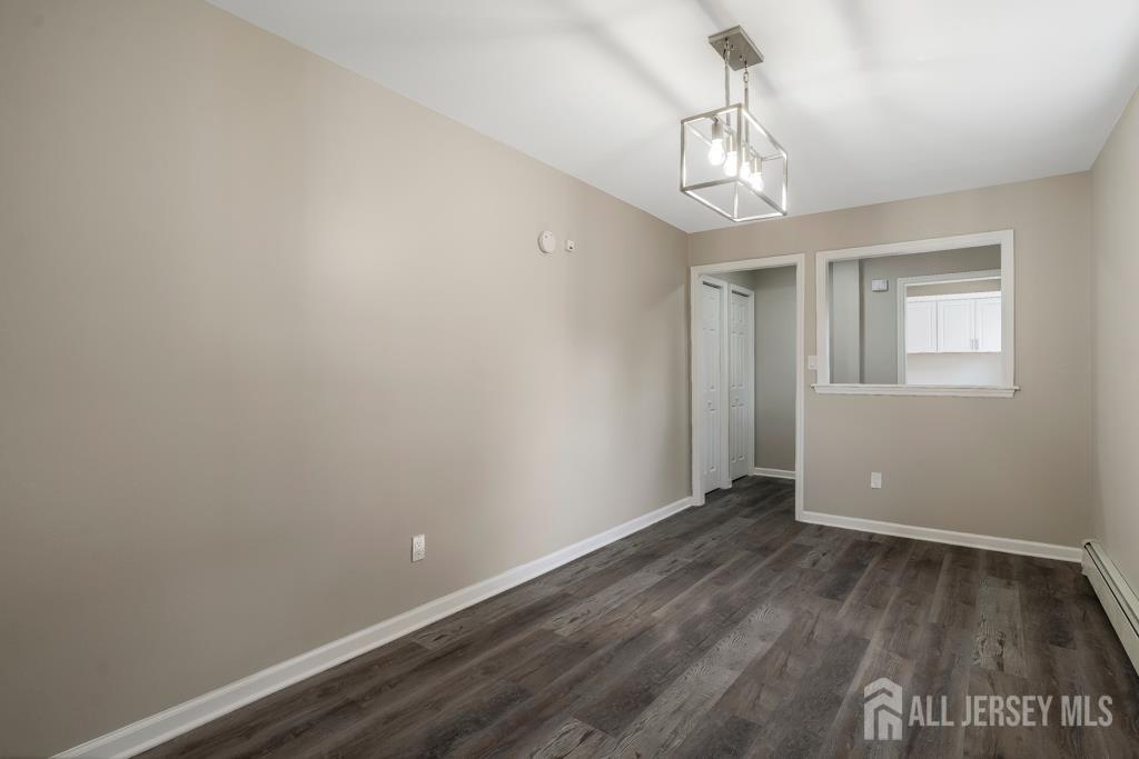 120 Chestnut Street Bridgewater, NJ 08807 - Photo 15 of 32 wooden floor in an empty room with a window