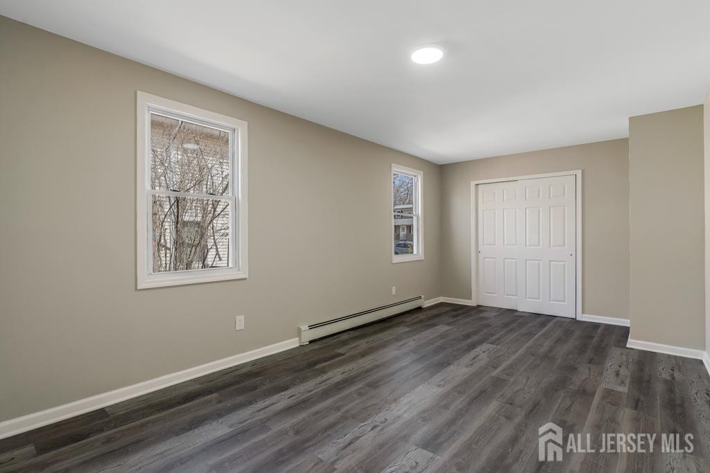 120 Chestnut Street Bridgewater, NJ 08807 - Photo 16 of 32 a view of an empty room with wooden floor and a window