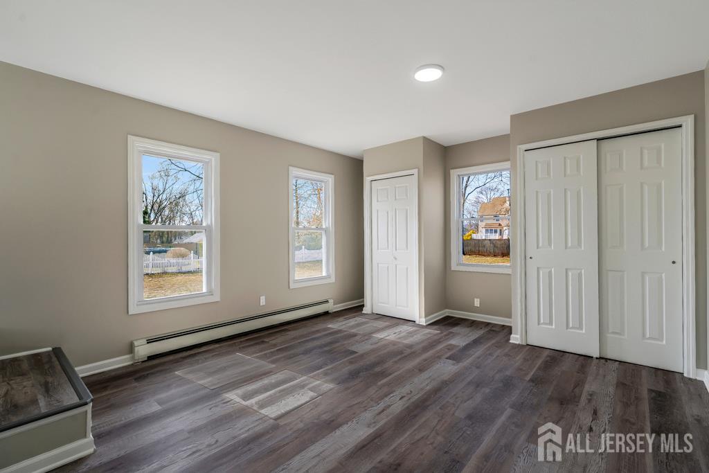 120 Chestnut Street Bridgewater, NJ 08807 - Photo 20 of 32 a view of an empty room with wooden floor and a window