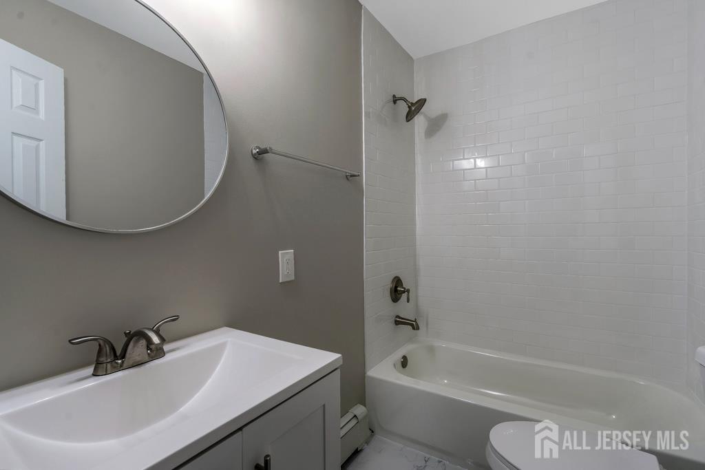 120 Chestnut Street Bridgewater, NJ 08807 - Photo 22 of 32 a bathroom with a sink a toilet and bathtub