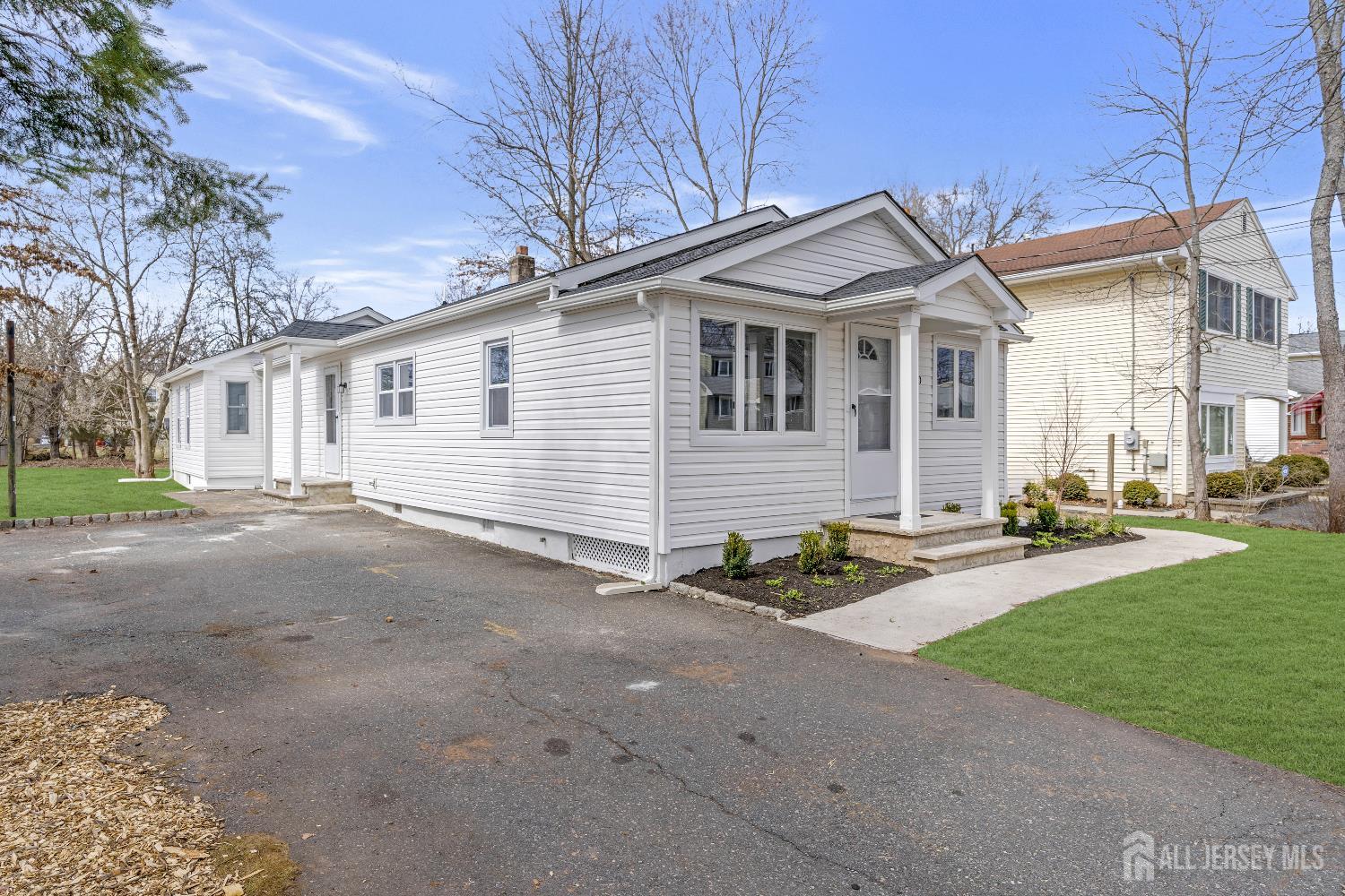 120 Chestnut Street Bridgewater, NJ 08807 - Photo 28 of 32 a view of a white house with a yard