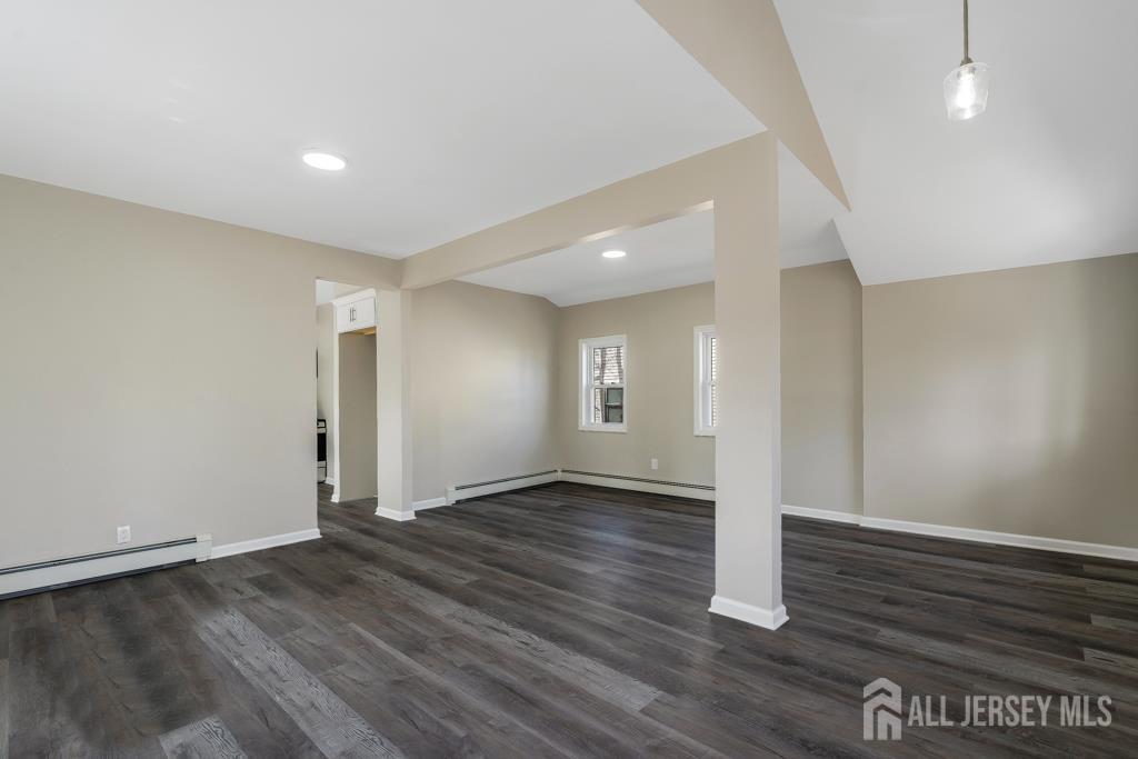 120 Chestnut Street Bridgewater, NJ 08807 - Photo 3 of 32 an empty room with wooden floor and windows