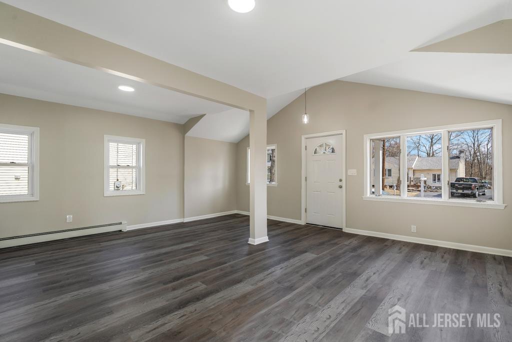 120 Chestnut Street Bridgewater, NJ 08807 - Photo 4 of 32 an empty room with wooden floor and windows