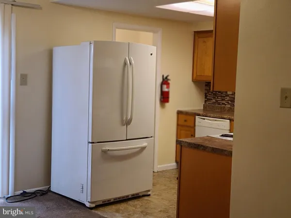 a refrigerator freezer sitting in a kitchen