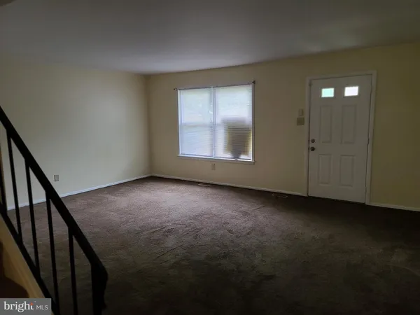 wooden floor and window in an empty room