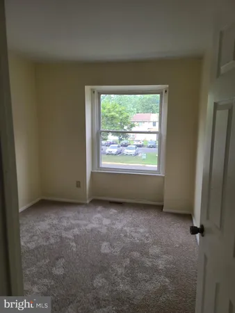 a view of a room that has a window in it