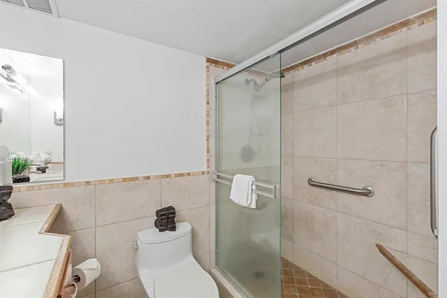 a bathroom with a double vanity sink and mirror