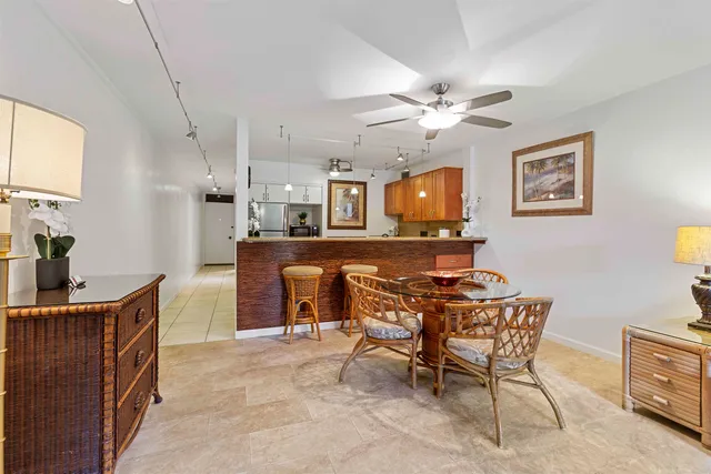 a living room with granite countertop furniture and a flat screen tv