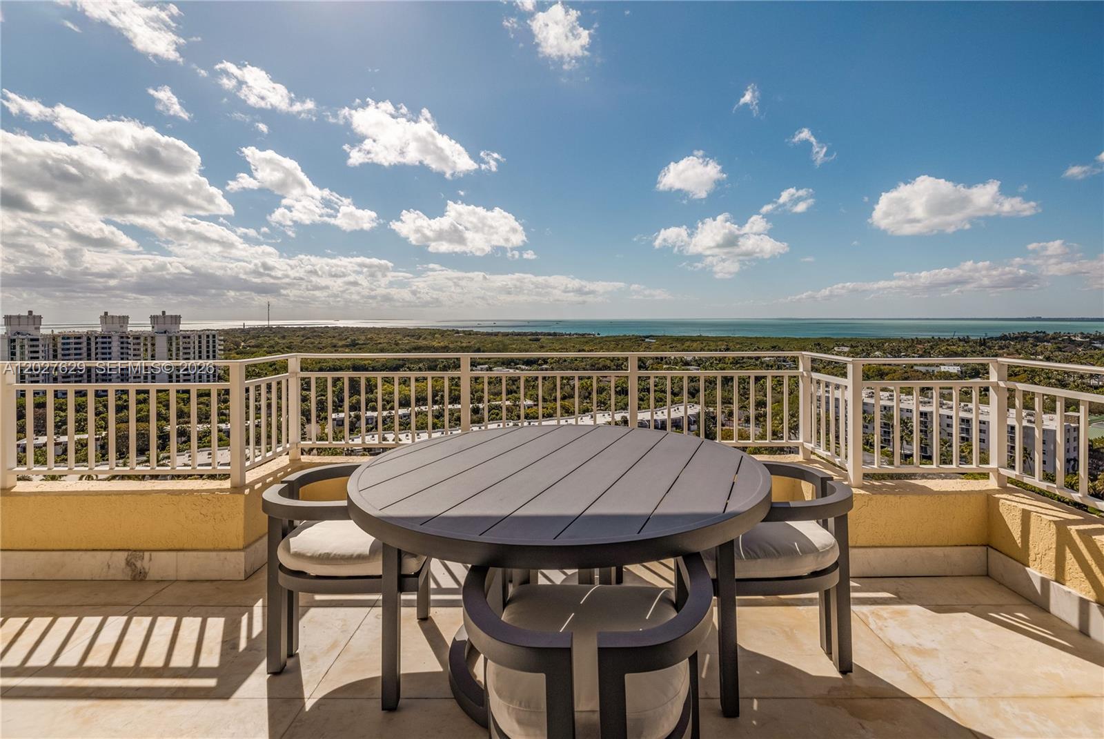 799 Crandon Boulevard, Unit PH8 Key Biscayne, FL 33149 - Photo 28 of 47 a view of a balcony with furniture