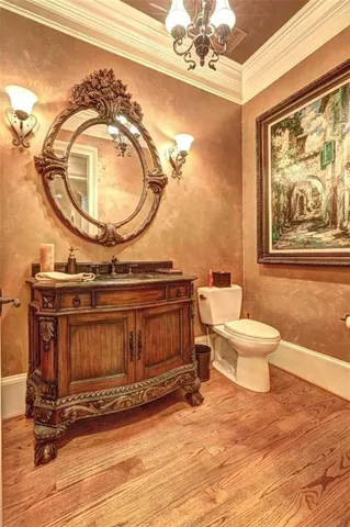 a living room with a furniture and a mirror