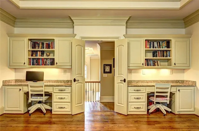 a view of a kitchen with dining table and chairs
