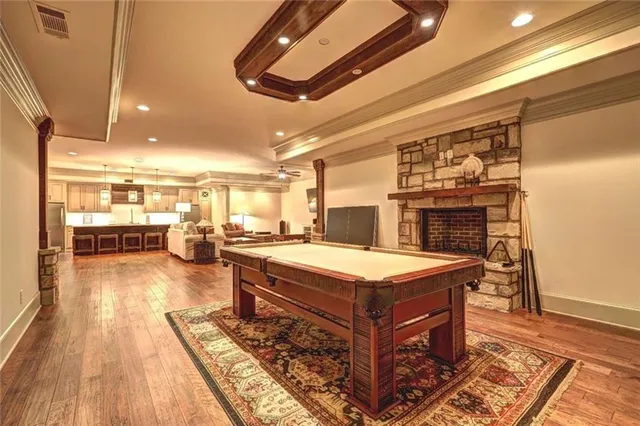 a room with lots of furniture and wooden floor