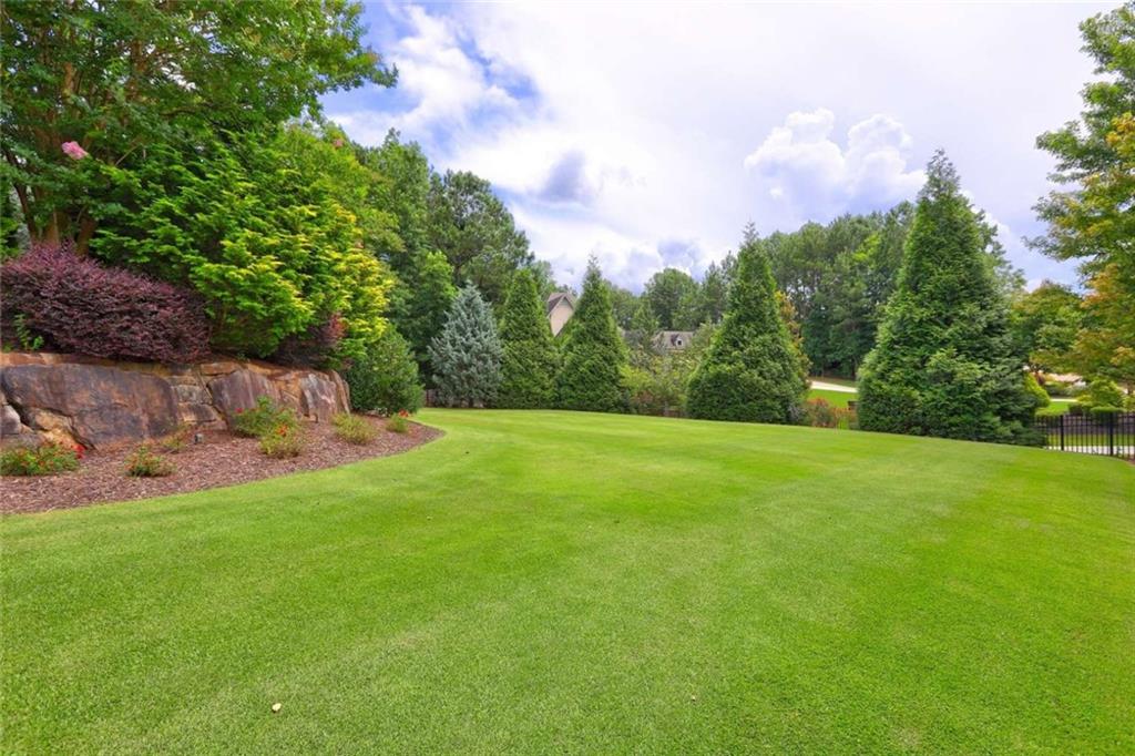 3027 Watsons Bend Milton, GA 30004 - Photo 36 of 39 a view of a field of grass and trees