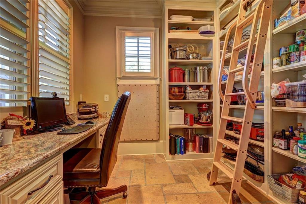 3027 Watsons Bend Milton, GA 30004 - Photo 8 of 39 a view of a workspace with bookshelf and a window