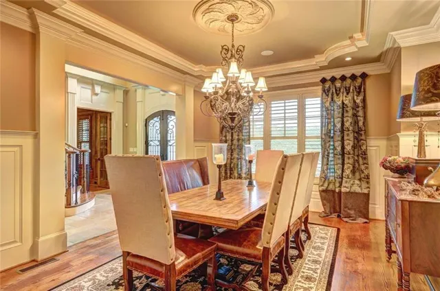 a view of a dining room with furniture and wooden floor