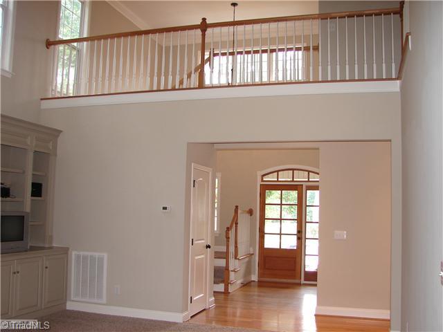 256 Old March Road Advance, NC 27006 - Photo 11 of 15 Interior Space/Layout. View of entry and upper level walkway from back door.