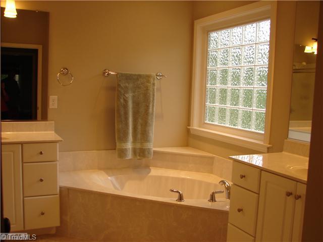 256 Old March Road Advance, NC 27006 - Photo 13 of 15 Master Bath/Spa. Master bath has two individual sinks, garden tub and separate shower.
