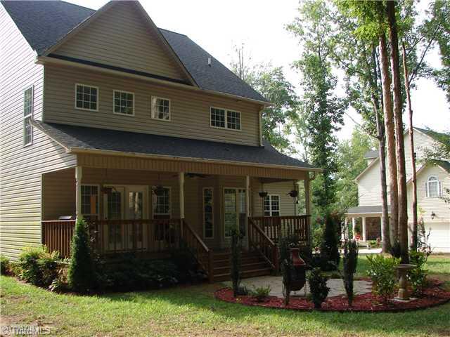 256 Old March Road Advance, NC 27006 - Photo 3 of 15 Exterior Back. Relax and enjoy nature from this large covered back porch.