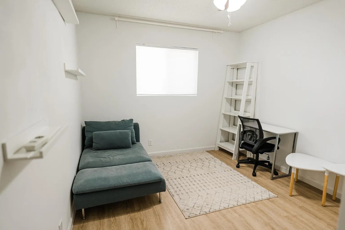 2600 Penny Lane, Unit 112 Austin, TX 78757 - Photo 12 of 20 a living room with furniture and a window