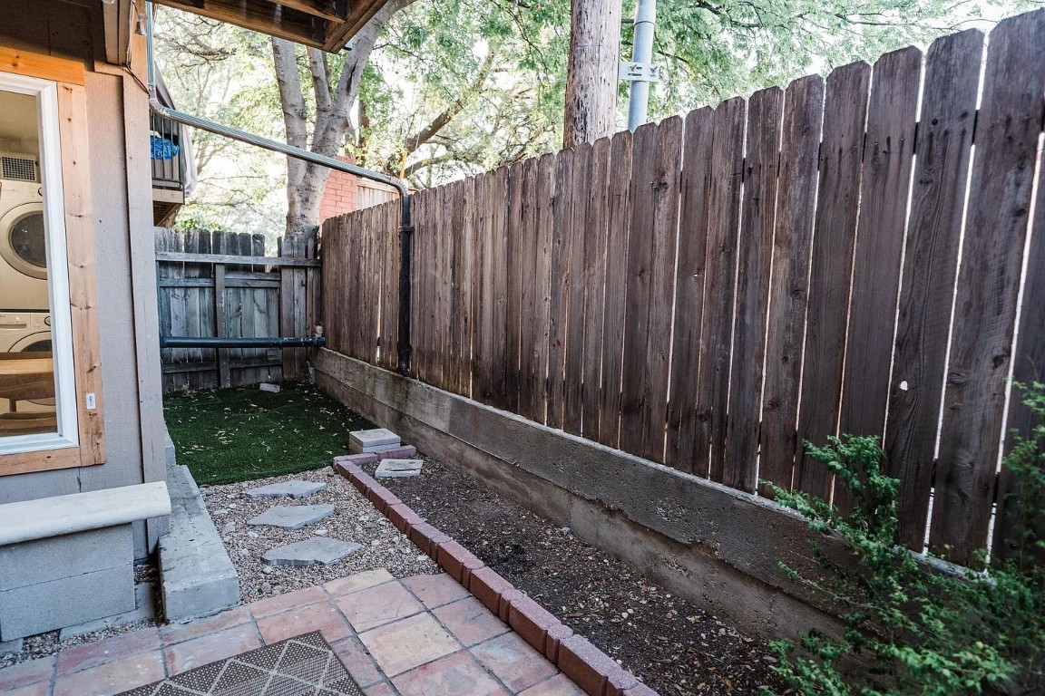 2600 Penny Lane, Unit 112 Austin, TX 78757 - Photo 19 of 20 a view of a backyard with a garden